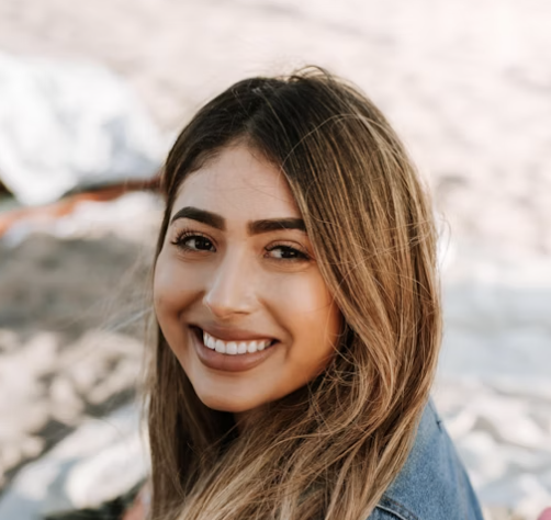 Smiling woman in denim jacket
